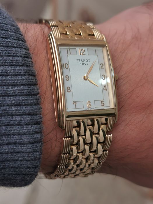Новий золотий годинник Tissot