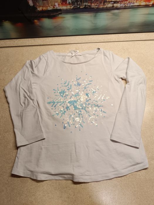 Bluzka biała długi rękaw z płatkiem śniegu z cekinów H&M 122/128 6-8
