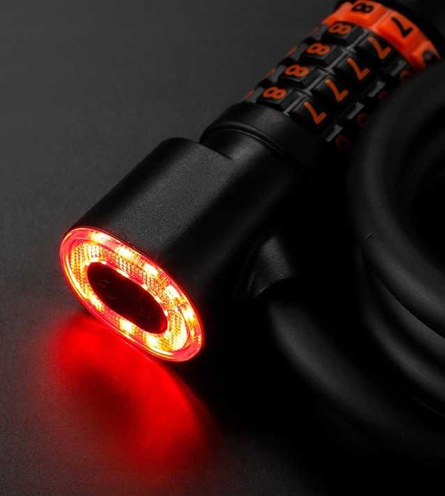 NOWE Zapięcie rowerowe 2w1: blokada z linką i tylną lampką LED
