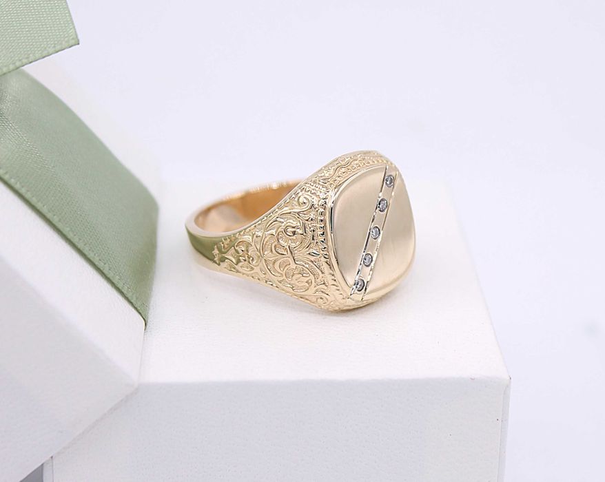 Złoty sygnet p.585/15,38g z brylantami