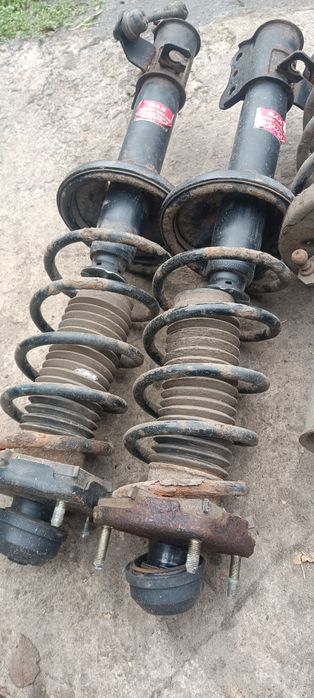 Стойки передние и задние Мазда 323 в сборе