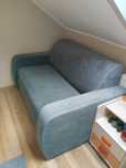 Piękna szara sofa rozkładana.