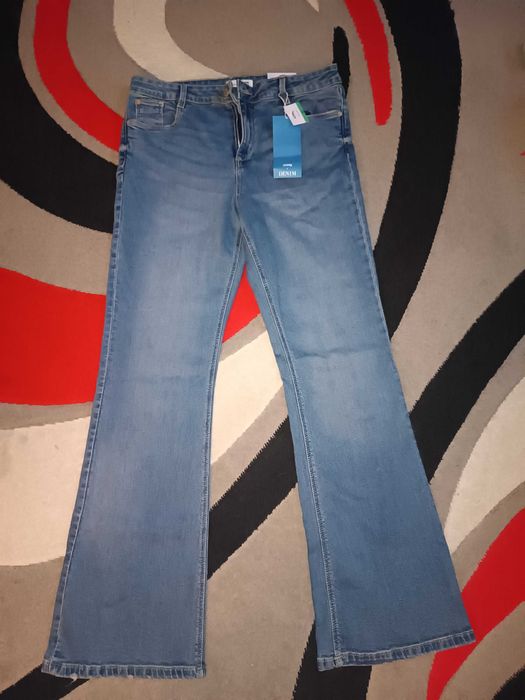 Nowe jeansy dzwony mid waist 42