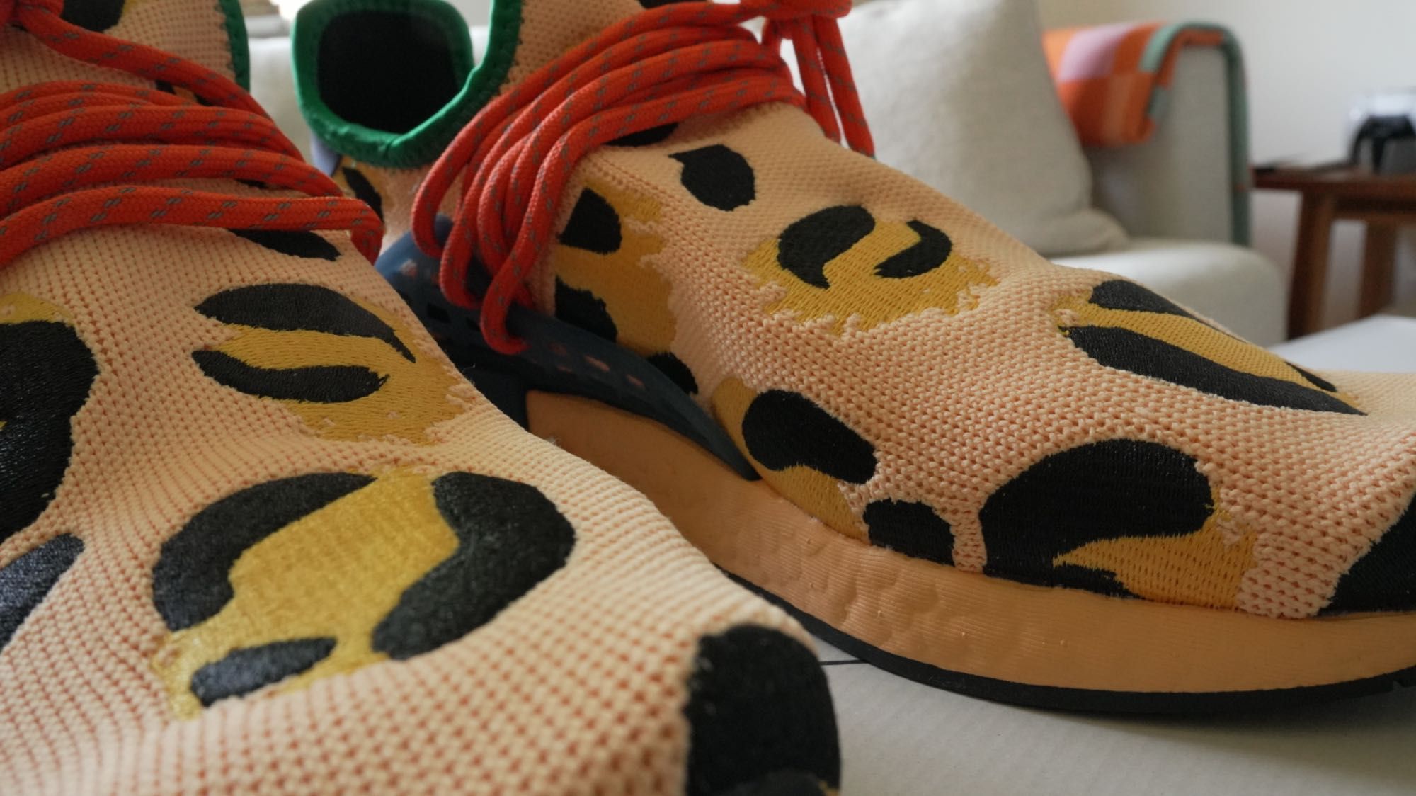 Adidas
x Pharrell HU NMD Animal Print "Amber" sneakers