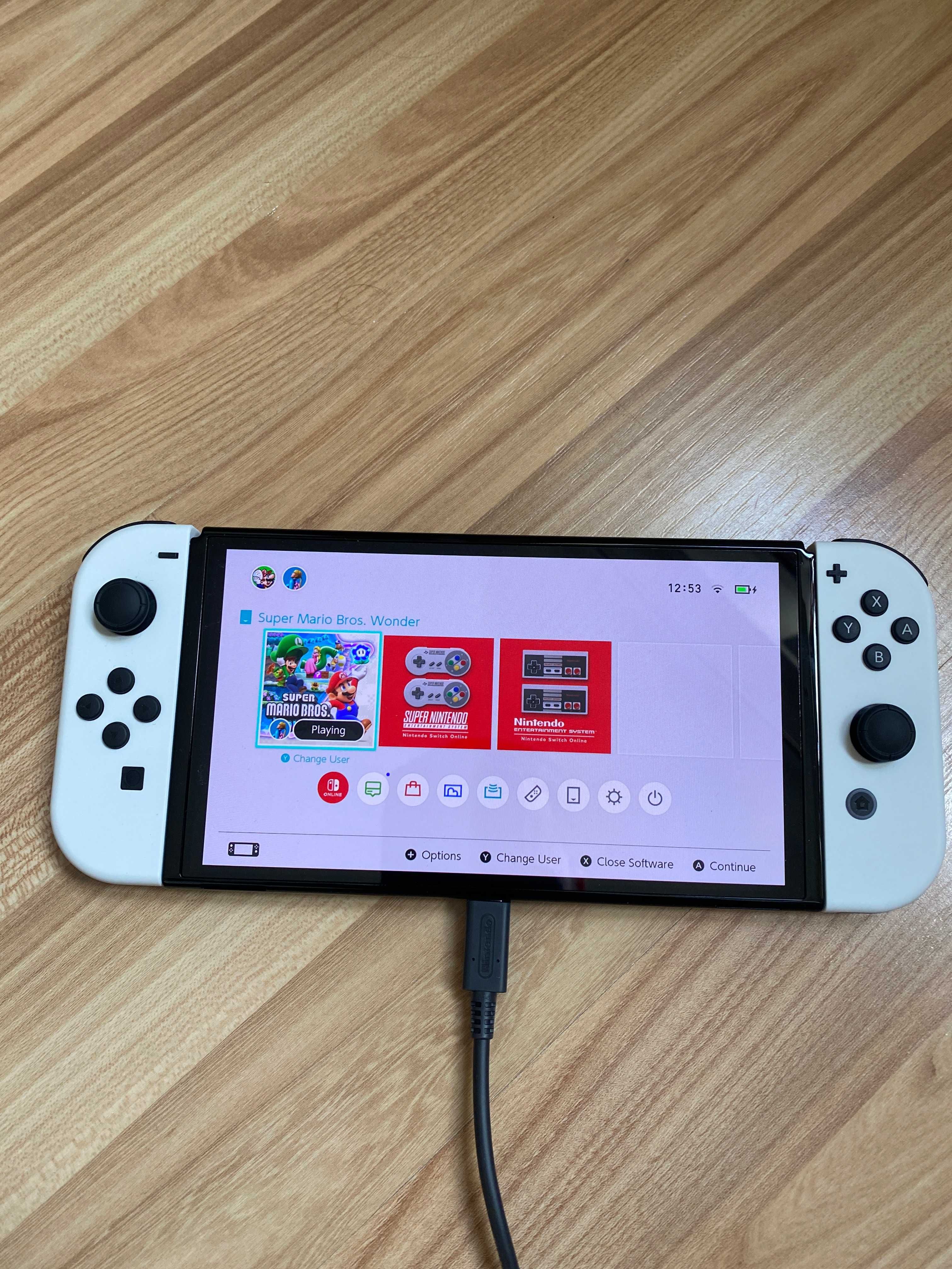 Nintendo Switch OLED + akcesoria (stan idealny), zakupione 12.2024
