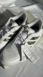 Кросівки adidas з принтом камуфляжу