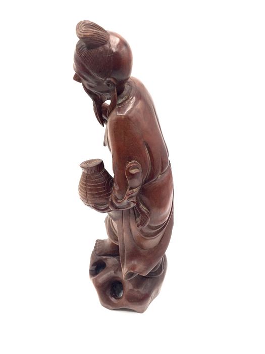 Escultura oriental em madeira zodiaca