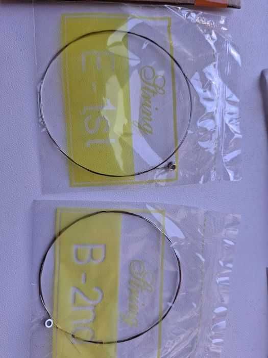 Струни  поштучно для гітари 1, 2, медіатор каподастр ремінь