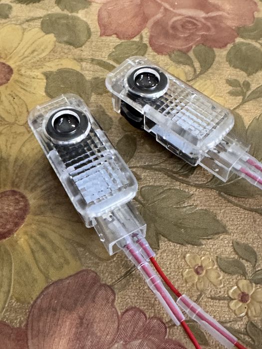 Проекци в двери vw