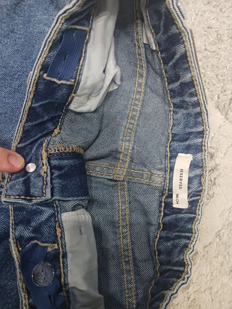 Spodnie jeans dziewczęce z dziurami roz 146 Reserved