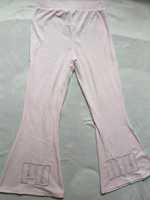 Różowe spodnie PUMA z szerokimi nogawkami Icons 2.0 L