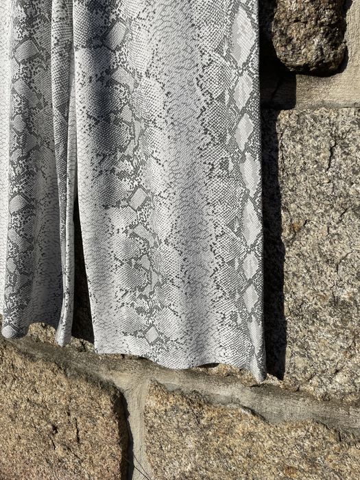 Calças estilo culotte em padrão cobra