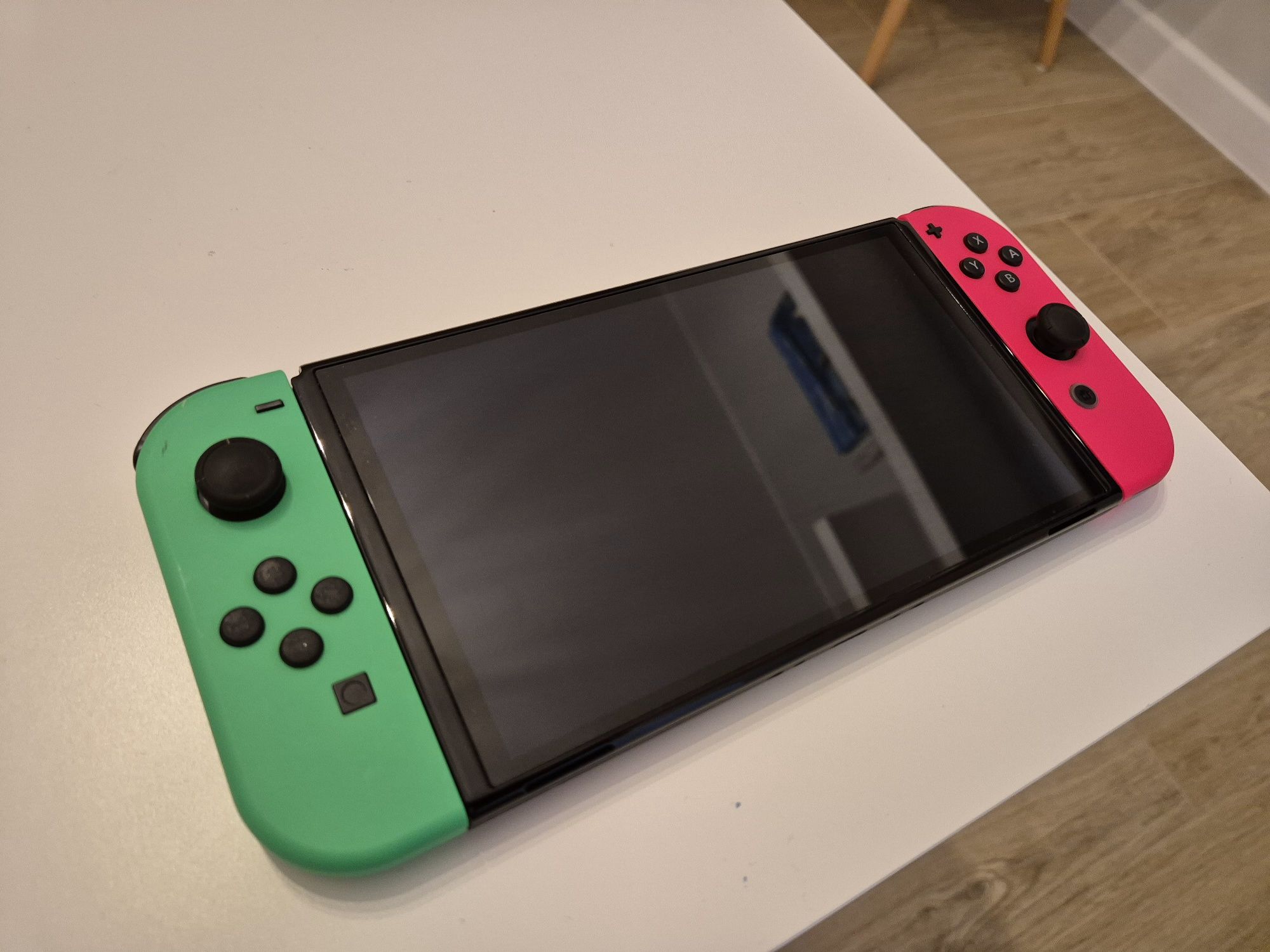 Zestaw: Nintendo Switch OLED + gry i akcesoria (Zelda, sports, arms)