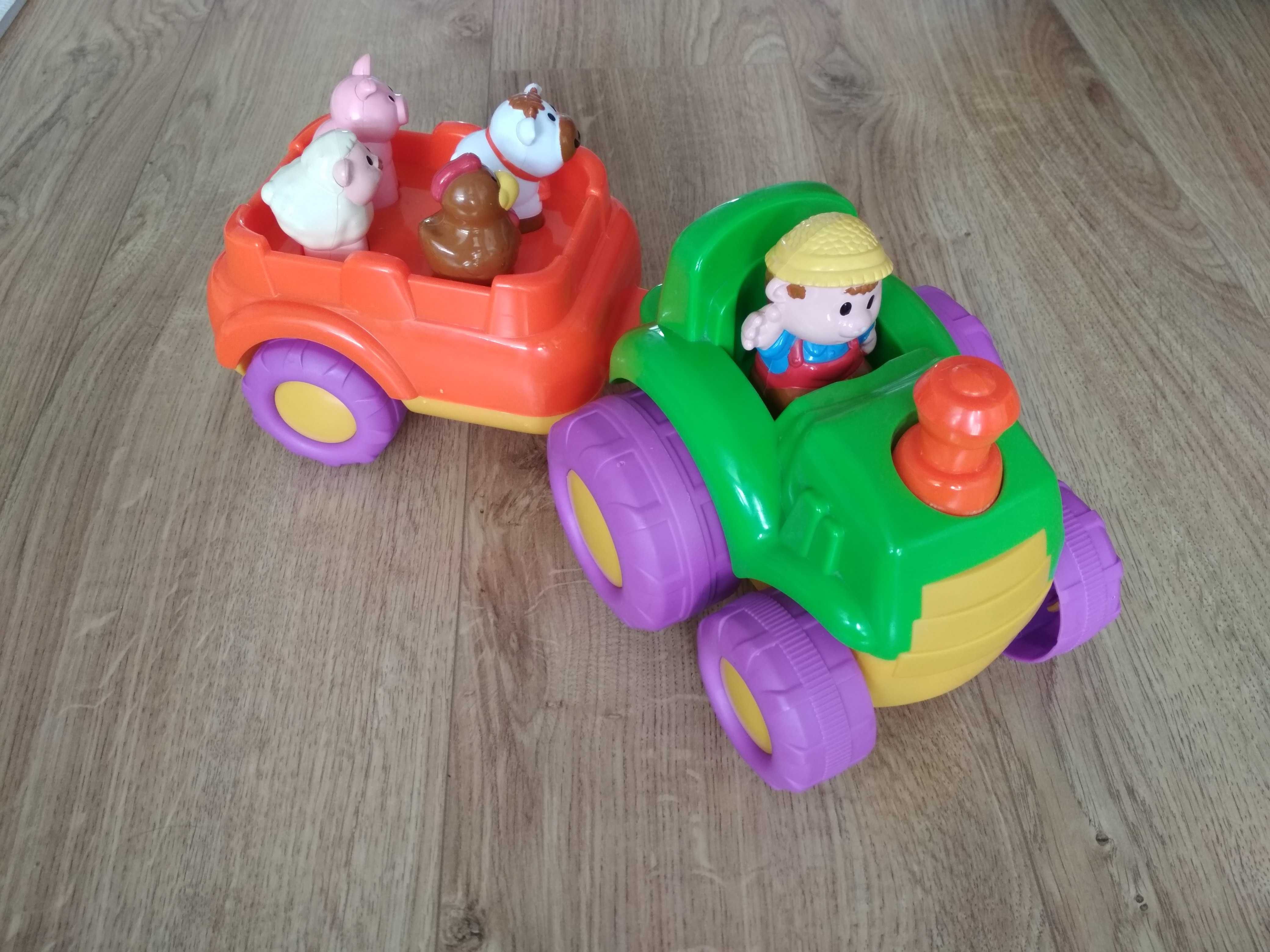 Zestaw zabawek: Grający traktor, wirujący bąk, układanka zębatki