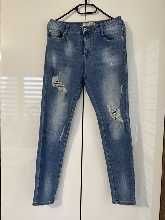 Jeansy damskie z rozdarciami rozmiar L