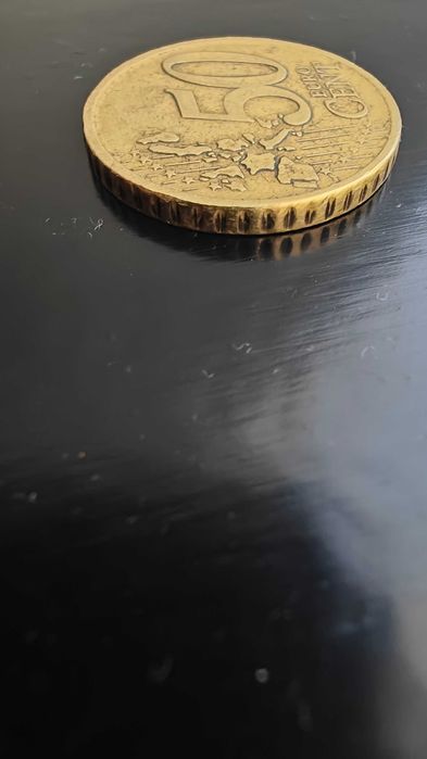 Moeda grega de 50c com F na estrela
