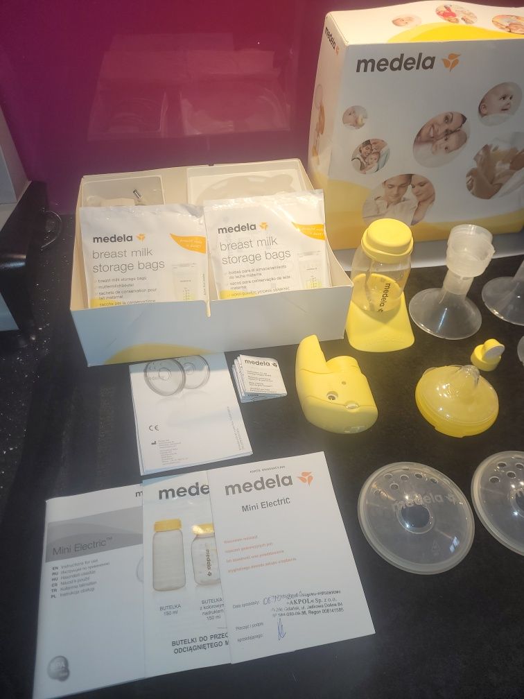 Laktator Medela Mini Electric plus woreczki nakładki na sutki i muszle