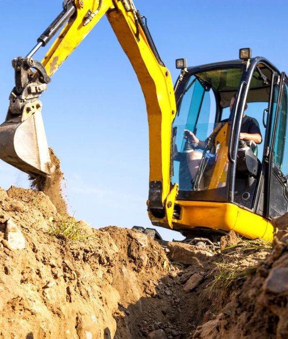 Usługi minikoparką Warszawa. Wykopy pod ogrodzenia