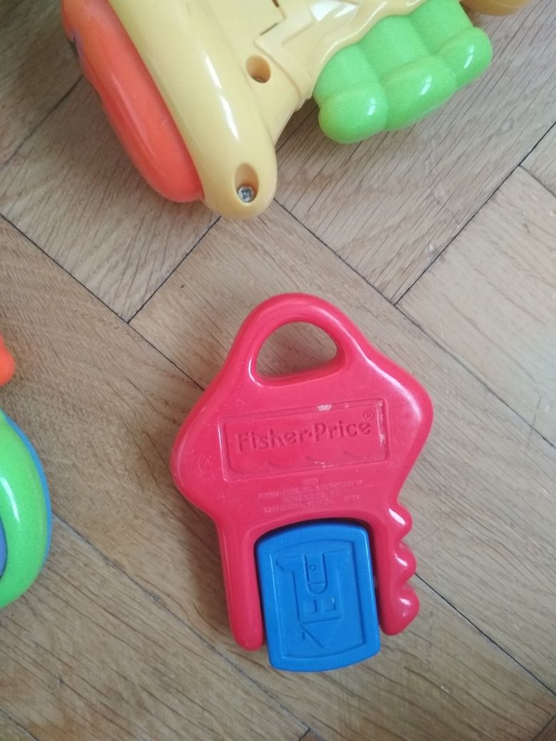 Zabawki Fisher Price pchacz krokodyl,grające pianinko, trąbka i klock