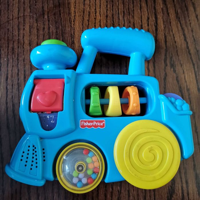 Wesoły pociąg – kolorowa lokomotywa Fisher Price