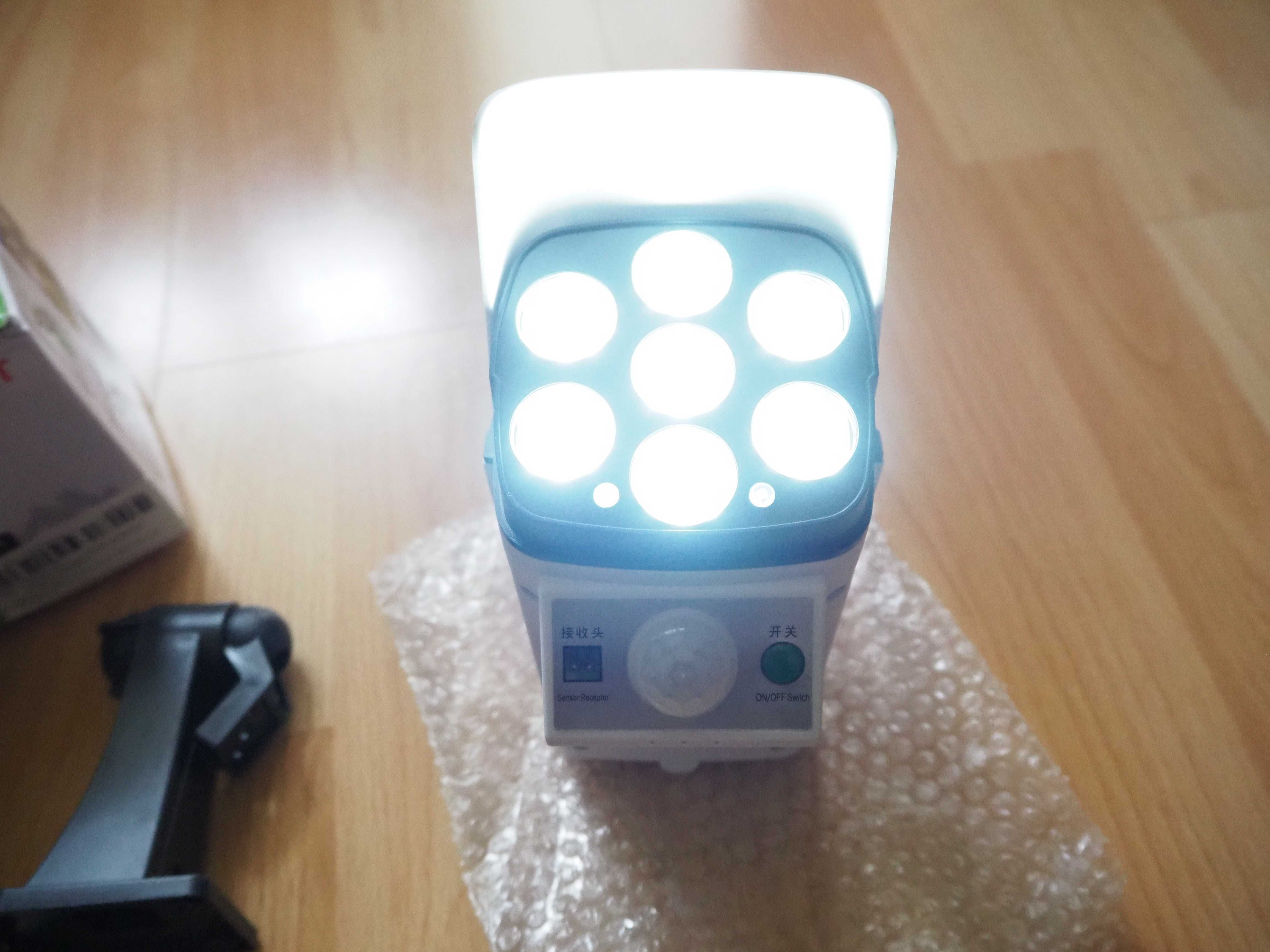 Lampa panel słoneczny - czujnik ruchu / zmierzchu - pilot 77 led NOWA
