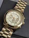 Zegarek Michael Kors zloty z datownikiem