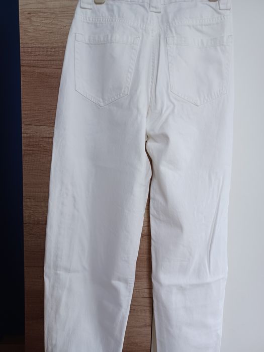 Spodnie z rozdarciami bawełniane jeansy kremowa biel damskie EUR 36 Be