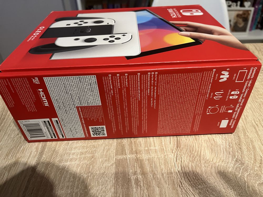 Nintendo Switch OLED Branca + Mumba oficial Case