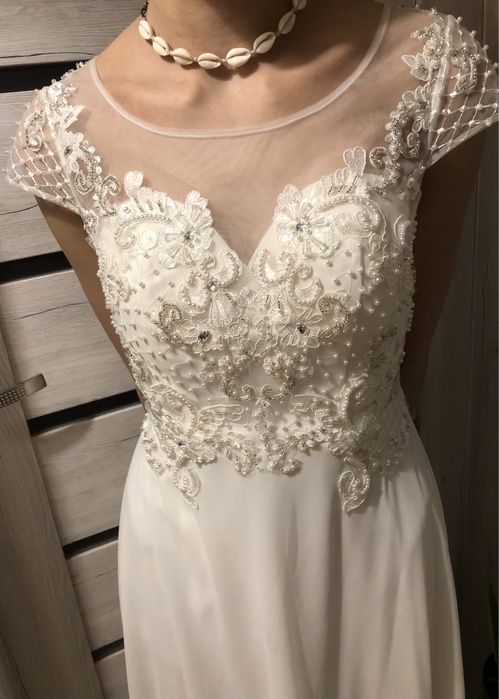 Przepiękna sukienka ślubna .