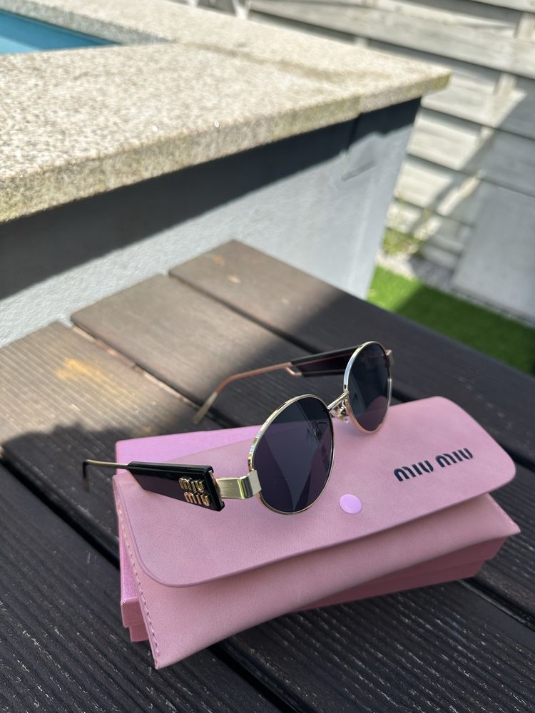 oculos miumiu novos ainda em caixa