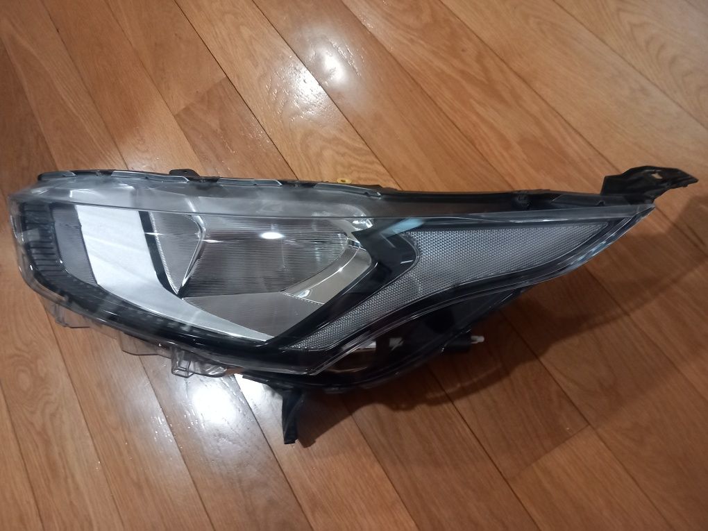 Farol optica frente esquerda Ford Transit Connect do ano 2018 a 2025.