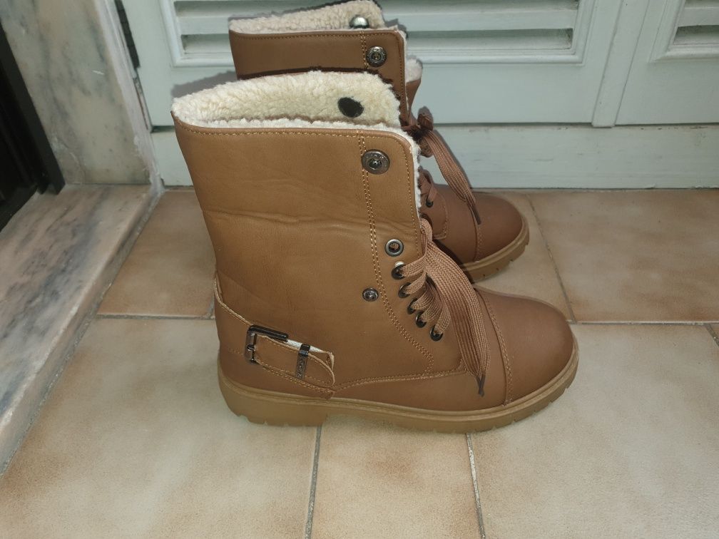 Botas cano alto com pelo