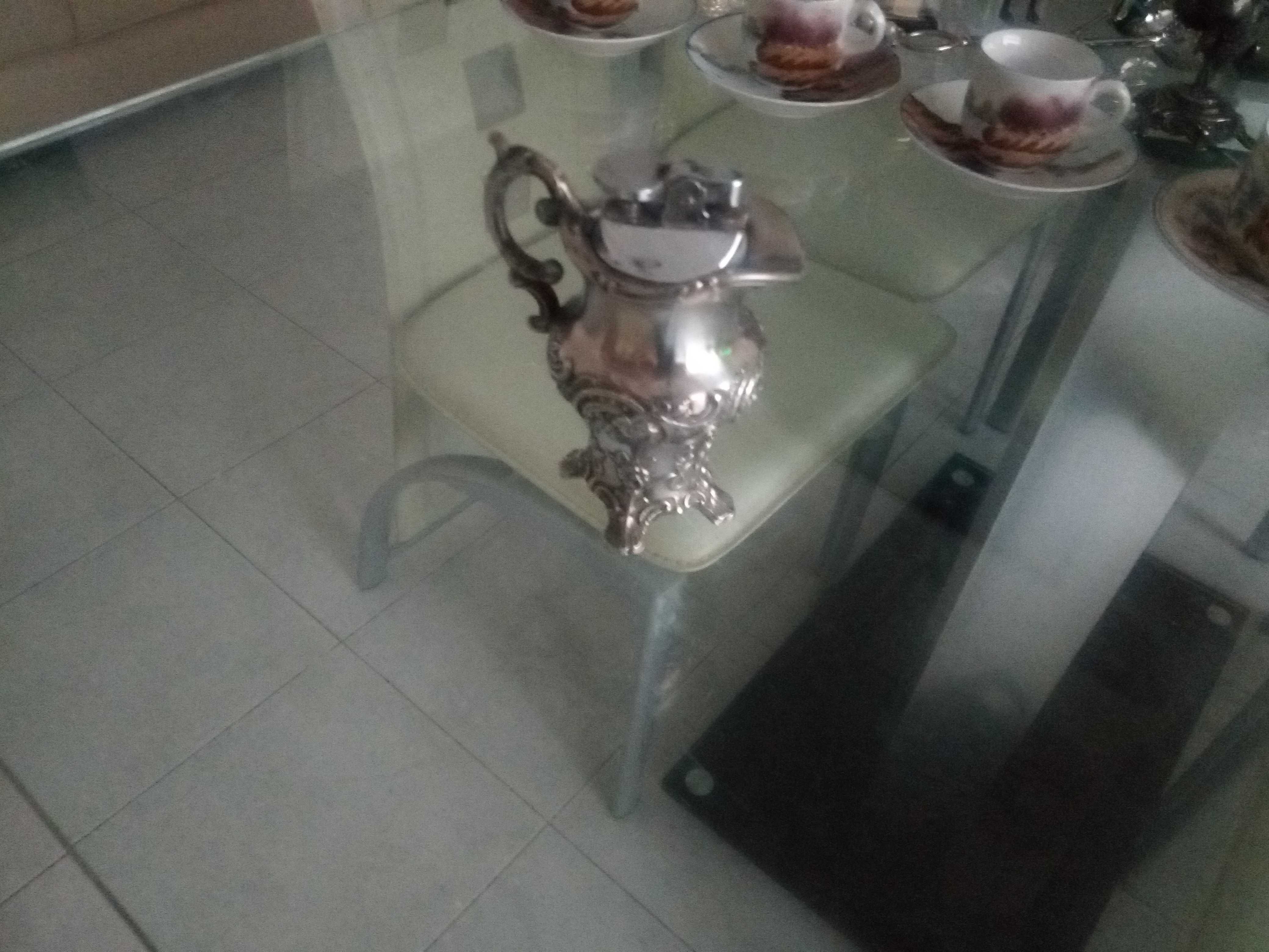 Vendo isqueiro banhado a prata em forma de jarro muito antigo