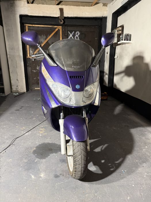 \ Piaggio X8 125 /