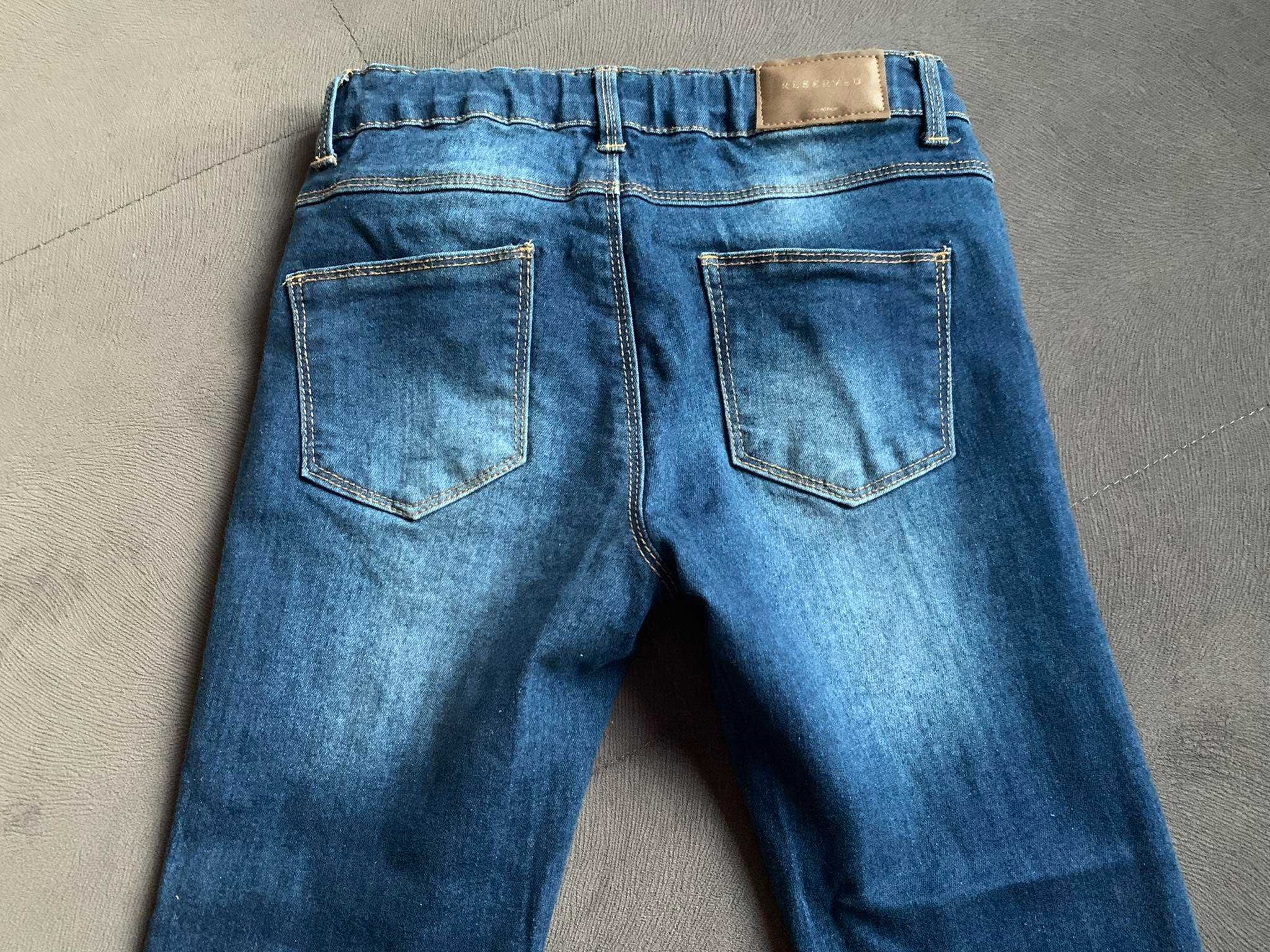 Spodnie jeansowe dziewczęce z przetarciami Reserved 134