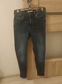 Nowe spodnie jeansowe Reserved r. 34