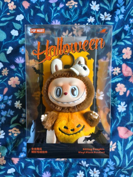 Labubu sitting pumpkin