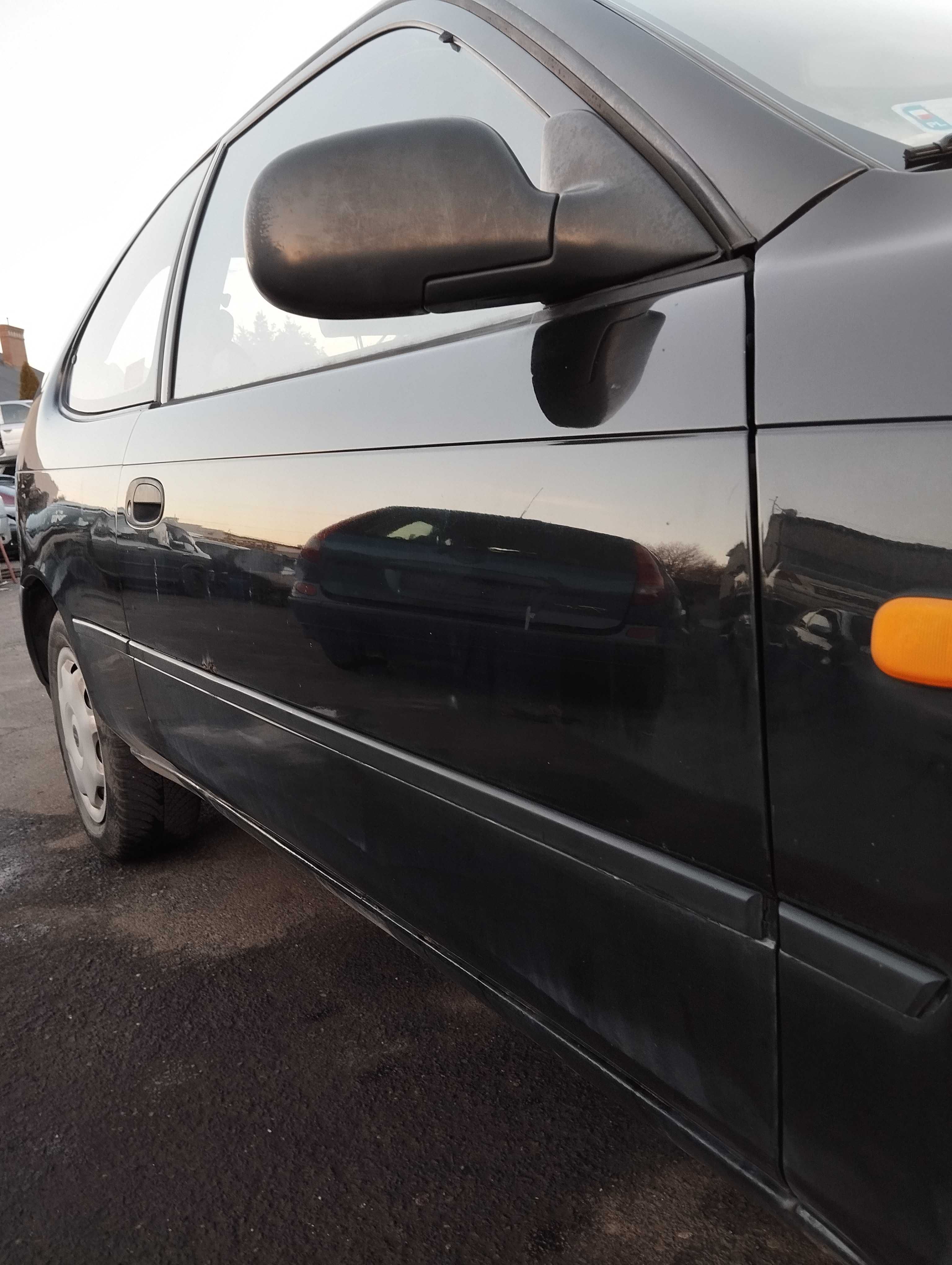 Toyota Corolla AE100 1.4i 3D 1996r.Lusterko zewnętrzne prawe.