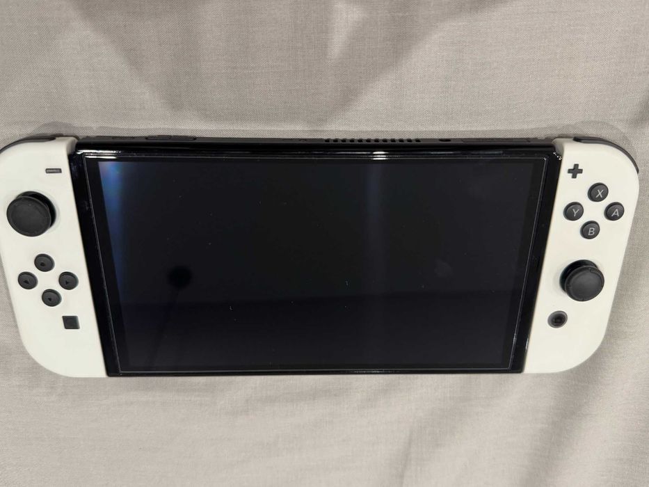 Nintendo Switch OLED with White Joy-Con + Legend of Zelda BOTW