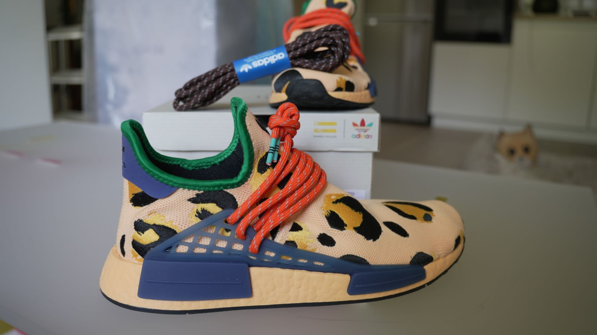 Adidas
x Pharrell HU NMD Animal Print "Amber" sneakers