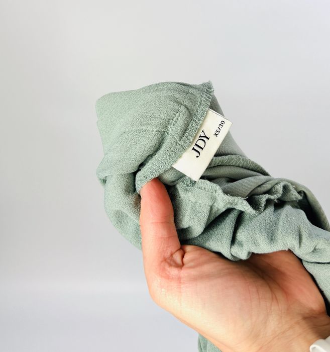 Miętowe spodnie z szeroką nogawką XS 34