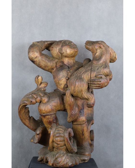 Młodzieniec z psem. Drewno. Rzeźba egzotyczna. XIX wiek.