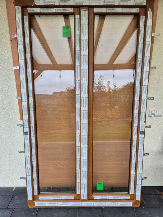 Nowe okno tarasowe 125x210 złoty dąb - białe, ruchomy słupek.