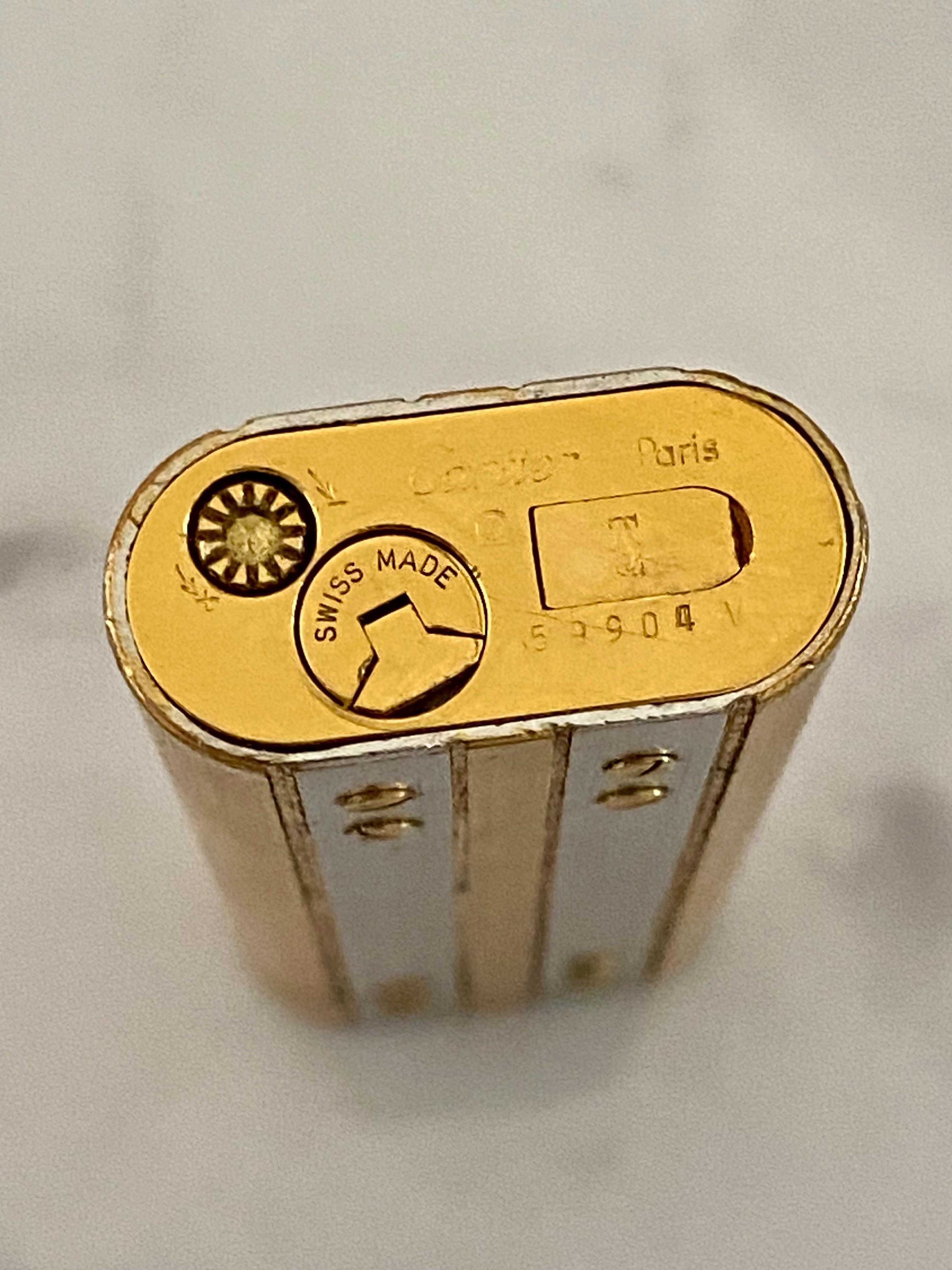 Isqueiro Cartier Santos Prateado e Dourado