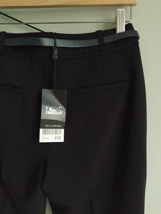 Damskie czarne, grubsze, jesienno zimowe chinosy z paskiem Next