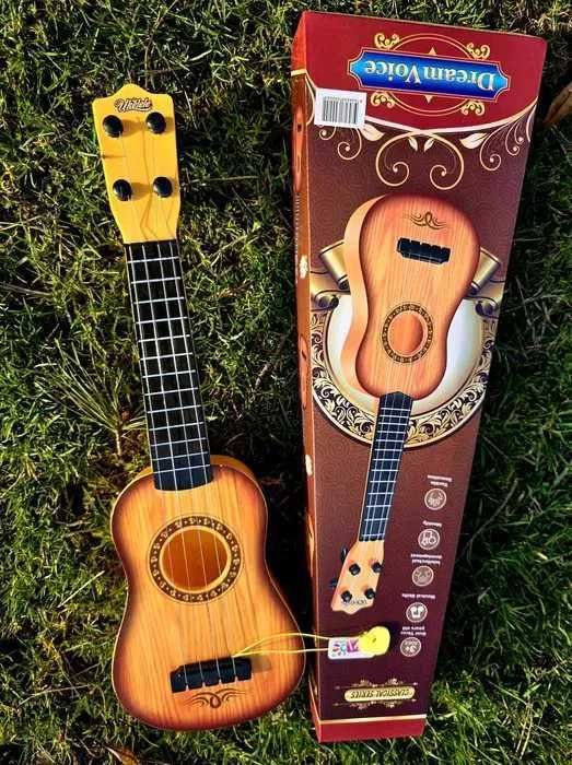 Brązowa nowa gitara dla dziecka zabawka instrument opakowanie