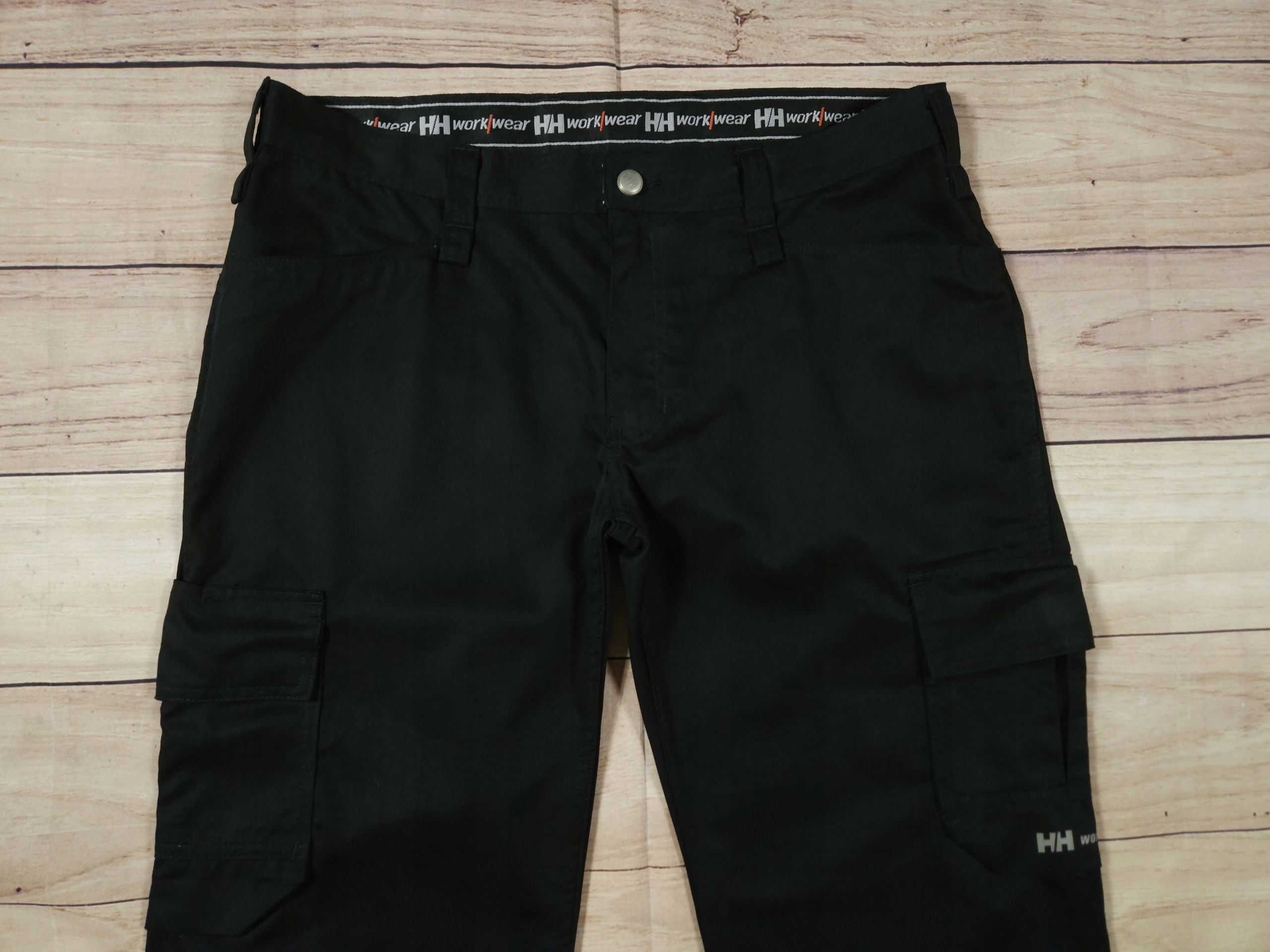 HELLY HANSEN WorkWear Spodnie Robocze Cargo Czarne Logowane r. C44