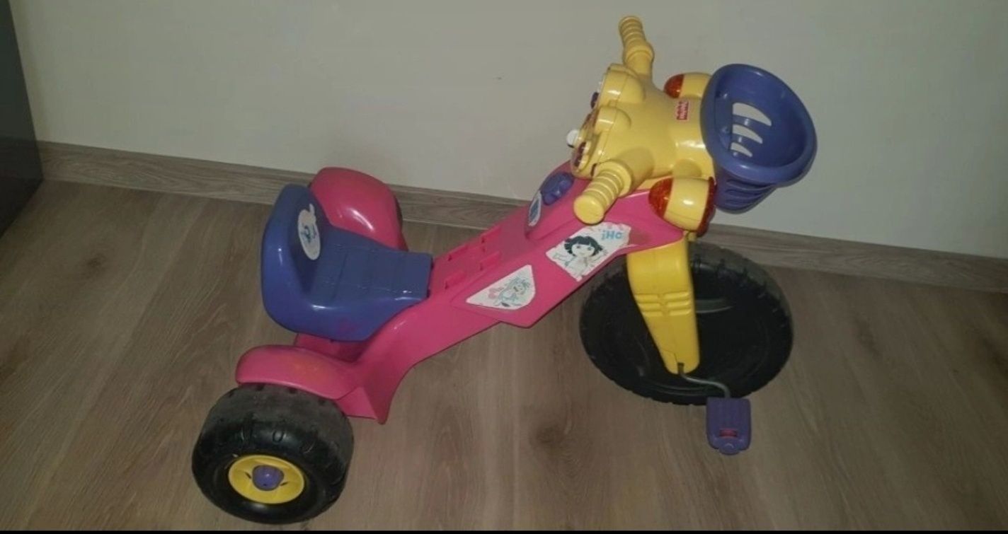 Skuter/ motor/ rower trojkolowy Fisher Price interaktywny z dźwiękami