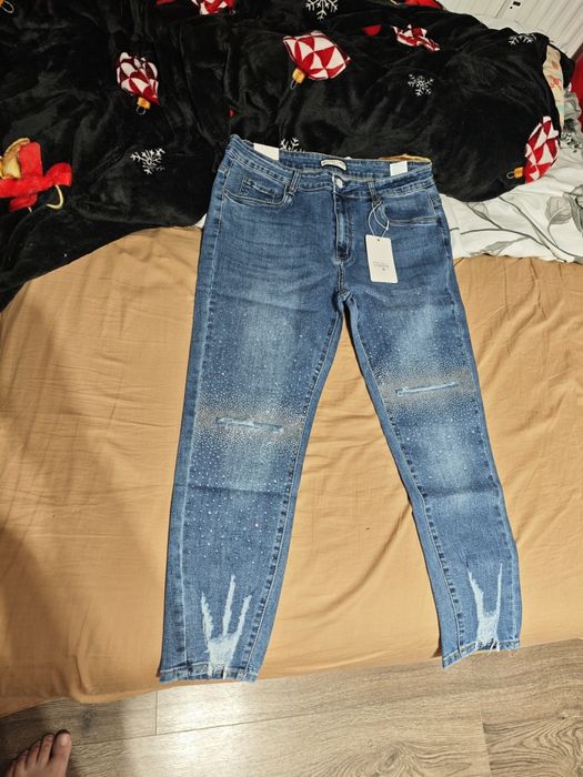 Spodnie jeans r50 z dziurami