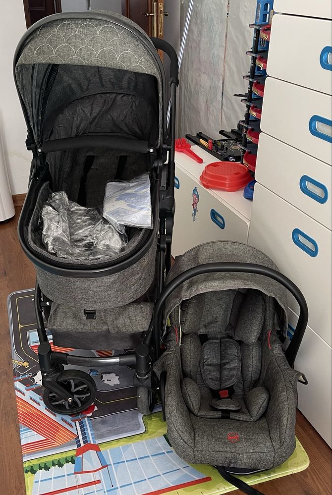 Carrinho bebé com alcofa e ovo.